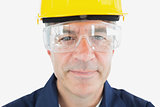 Mechanic wearing hardhat and protective glasses