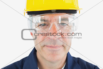 Mechanic wearing hardhat and protective glasses