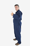 Portrait of mature technecian gesturing thumbs up sign