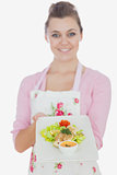 Young woman holding plate of healthy meal