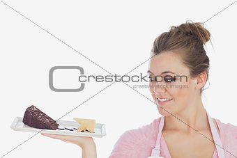 Young woman looking at pastry