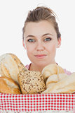 Young woman with variety of breads