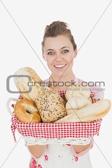 Young maid holding bread basket