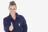 Female technician showing thumbs up sign