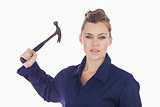 Female technician holding claw hammer