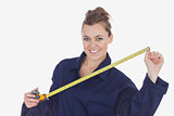 Female technician holding measuring tape