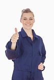 Female mechanic showing thumbs up sign