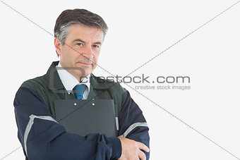 Handsome repairman with clipboard