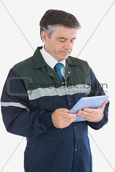 Repairman using digital tablet