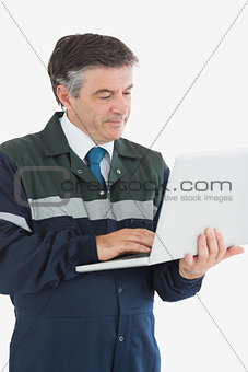 Repairman using laptop