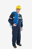 Portrait of mature repairman with large wire and hardhat