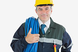 Confident mature man with rolled wire