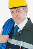 Portrait of repairman with large wire and hardhat
