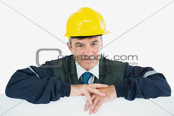 Repairman leaning on billboard