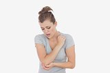 Unhappy woman with elbow pain