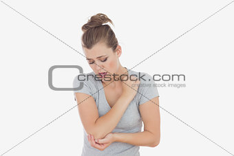 Unhappy woman with elbow pain