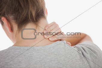 Closeup of woman suffering from neckache