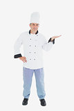 Mature chef presenting invisible product