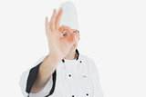 Mature chef showing ok sign