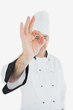 Mature chef in uniform showing ok sign