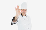 Male chef in uniform showing ok sign