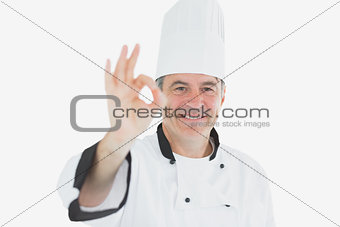 Happy mature chef gesturing ok sign