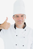 Chef in uniform showing thumbs up sign