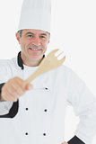 Happy chef showing spatula