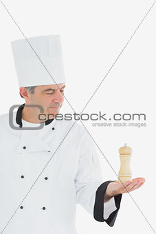 Chef holding salt shaker