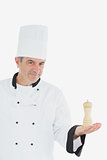 Confident chef holding salt shaker