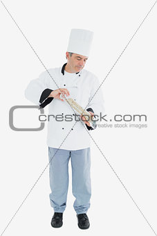 Chef using pepper mill