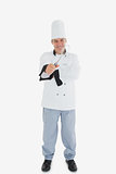 Happy chef holding wire whisk