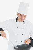 Portrait of male chef cooking food