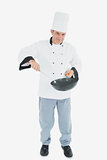 Confident chef cooking food