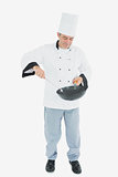 Man in chef uniform cooking food