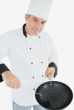 Chef with spatula and frying pan