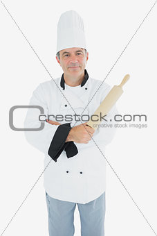 Male chef holding rolling pin