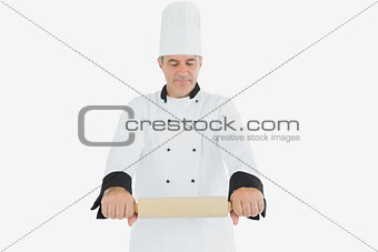Male chef holding rolling pin
