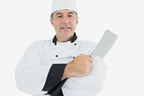 Male chef holding meat cleaver