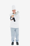 Male chef showing meat cleaver
