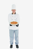 Chef holding pizza