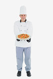 Mature male chef holding pizza