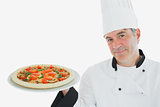 Happy chef holding delicious pizza