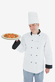 Confident male chef with pizza
