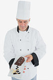Chef looking at chocolate pastry
