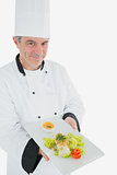 Chef offering fresh prepared meal