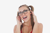 Cheerful woman listening music