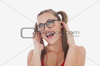 Cheerful woman listening music