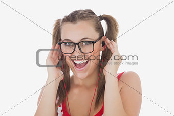Happy young woman listening music
