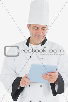 Male chef using tablet pc